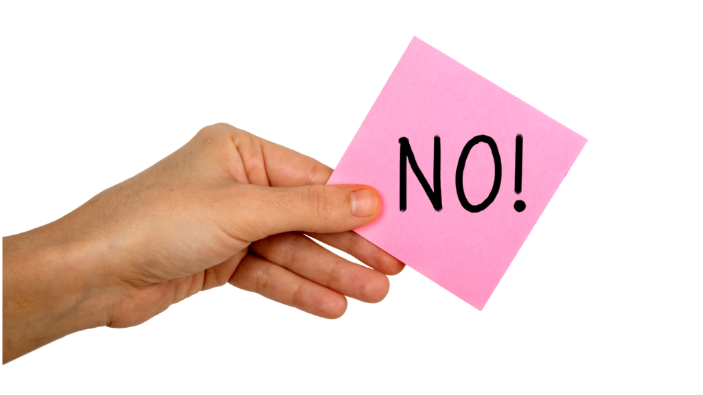 A hand holding a NO post